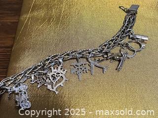 MaxSold Auction: Sterling Silver &#39;Dynasty&#39; Charm Bracelet &#38; 10 Charms - Toronto (Ontario, Canada) SELLER MANAGED Estate Sale Online Auction - Roxton Road