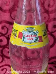 MaxSold Auction: large vintage Soda bottel yellow lable  - Inverary (Ontario, Canada) SELLER MANAGED Moving Online Auction - Battersea Road