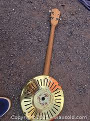 MaxSold Auction: Art Deco Guitar with Brass/Gold-Tone Coverplate, Chrome Hub - Gananoque (Ontario, Canada) SELLER MANAGED Downsizing Online Auction -  Highway 2 West(STORAGE)                      