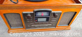 MaxSold Auction: Crosley Portable Turntable in Wood-Grain Case - Gananoque (Ontario, Canada) SELLER MANAGED Downsizing Online Auction -  Highway 2 West(STORAGE)                      