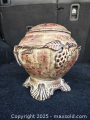 MaxSold Auction: Decorative Metal Pot Footed With Lid On Chain 10" tall with lid - Gananoque (Ontario, Canada) SELLER MANAGED Downsizing Online Auction -  Highway 2 West(STORAGE)                      