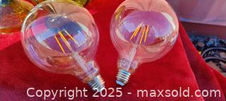 MaxSold Auction: IKEA LED Filament Globe Light Bulbs E26/E27 - 2-Pack and green candy jar with lid - Gananoque (Ontario, Canada) SELLER MANAGED Downsizing Online Auction -  Highway 2 West(STORAGE)                      