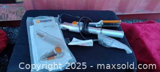 MaxSold Auction: InStyler Rotating Hot Brush / Styling Iron, Silver with Orange Accents - Gananoque (Ontario, Canada) SELLER MANAGED Downsizing Online Auction -  Highway 2 West(STORAGE)                      