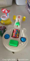 MaxSold Auction: Mixed Lot of Children's Plastic Toys with Fisher-Price Busy Guitar - Plainville (Massachusetts, USA) SELLER MANAGED Downsizing Online Auction -  West Bacon Street