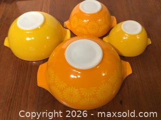 MaxSold Auction: Vintage - Pyrex “Daisy” Cinderella mixing bowls, orange & yellow 1968.  (set of 4) - Kawartha Lakes (Ontario, Canada) SELLER MANAGED Estate Sale Online Auction - Evergreen Street