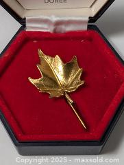 MaxSold Auction: gold toned leaf brooch pin Maple Leaf in holder - South Frontenac (Ontario, Canada) SELLER MANAGED Downsizing Online Auction - Battersea Road