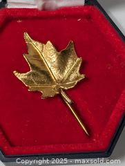 MaxSold Auction: gold toned leaf brooch pin Maple Leaf in holder - South Frontenac (Ontario, Canada) SELLER MANAGED Downsizing Online Auction - Battersea Road