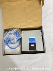 MaxSold Auction: Linksys (Cisco-era) vintage network device — router/voice gateway/ATA - Toronto (Ontario, Canada) SELLER MANAGED Reseller Online Auction -  York Mills Road