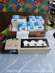 MaxSold Auction: Assorted Light Bulbs and  Mirrored 3 Bath Bar Lights - Capitol Heights (Maryland, USA) SELLER MANAGED Downsizing Online Auction - Quo Avenue