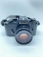MaxSold Auction: Nikon EM 35mm SLR (Film) with 50mm f/1.8 - Smiths Falls (Ontario, Canada) SELLER MANAGED Reseller Online Auction -  Autumn Drive