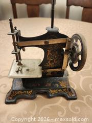 MaxSold Auction: Antique Childs Miniature Hand-Crank Sewing Machine, Unmarked No. 38705 - Ajax (Ontario, Canada) SELLER MANAGED Estate Sale Online Auction - Billingsgate Crescent