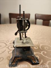 MaxSold Auction: Antique Childs Miniature Hand-Crank Sewing Machine, Unmarked No. 38705 - Ajax (Ontario, Canada) SELLER MANAGED Estate Sale Online Auction - Billingsgate Crescent