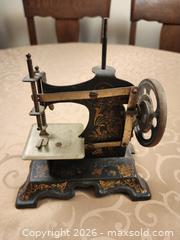 MaxSold Auction: Antique Childs Miniature Hand-Crank Sewing Machine, Unmarked No. 38705 - Ajax (Ontario, Canada) SELLER MANAGED Estate Sale Online Auction - Billingsgate Crescent