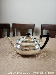 MaxSold Auction: Silver plated teapot with black hand and lid  - Ajax (Ontario, Canada) SELLER MANAGED Estate Sale Online Auction - Billingsgate Crescent
