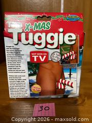 MaxSold Auction: NEW ~ The X-Mas Tuggie  - Kingston (Ontario, Canada) SELLER MANAGED Downsizing Online Auction - Steve Fonyo Drive (STORAGE)