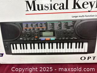 MaxSold Auction: Optimus 49-Key Portable Electronic Keyboard (Mini Keys) - Renfrew (Ontario, Canada) SELLER MANAGED Downsizing Online Auction - Plaunt Street South