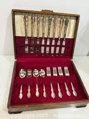 MaxSold Auction: 1847 Rogers Bros “Reflection” Silverplate Flatware Set with Wooden Storage Chest - New Westminster (British Columbia, Canada) SELLER MANAGED Reseller Online Auction - Columbia Street