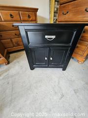 MaxSold Auction: Klaussner Black Wood Nightstand with Drawer and Double Doors - Chesapeake (Virginia, USA) PARTNER MANAGED Downsizing Online Auction - River Arch Drive