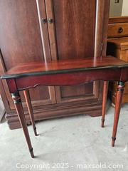 MaxSold Auction: Narrow Wood Console/Entryway Table, Reddish-Brown w/ Black Edging - Chesapeake (Virginia, USA) PARTNER MANAGED Downsizing Online Auction - River Arch Drive