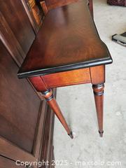 MaxSold Auction: Narrow Wood Console/Entryway Table, Reddish-Brown w/ Black Edging - Chesapeake (Virginia, USA) PARTNER MANAGED Downsizing Online Auction - River Arch Drive