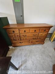 MaxSold Auction: Solid Pine Lowboy Dresser, 12 Drawers, Honey-Brown Finish - Chesapeake (Virginia, USA) PARTNER MANAGED Downsizing Online Auction - River Arch Drive