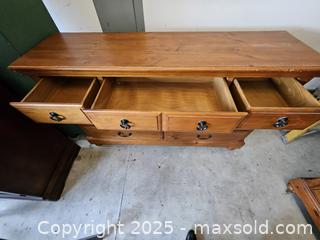 MaxSold Auction: Solid Pine Lowboy Dresser, 12 Drawers, Honey-Brown Finish - Chesapeake (Virginia, USA) PARTNER MANAGED Downsizing Online Auction - River Arch Drive