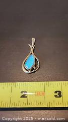 MaxSold Auction: 9kt pendent with firey blue stone - Elgin (Ontario, Canada) SELLER MANAGED Estate Sale Online Auction - Main