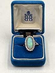 MaxSold Auction: 18K White Gold with Diamonds and Large Opal.  Appraisal Certificate. Size: 5.25 - Oakville (Ontario, Canada) PARTNER MANAGED Estate Sale Online Auction - Lakeshore Road West (Shipping Available)                     