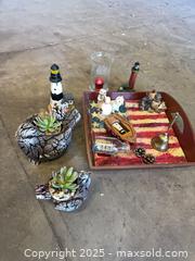 MaxSold Auction: Mixed Nautical Home Decor Lot: Tray, Planters, Lighthouses, Glass - Garden City (Georgia, USA) SELLER MANAGED Downsizing Online Auction -  Bryce Industrial Drive