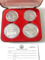 MaxSold Auction: Four 1976 Olympic commemorative silver coins  - Toronto (Ontario, Canada) SELLER MANAGED Downsizing Online Auction - Dingwall Avenue