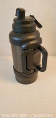 MaxSold Auction: Large Black Water Bottle w/handle   - Rockaway (New Jersey, USA) SELLER MANAGED Downsizing Online Auction - Miami Trail