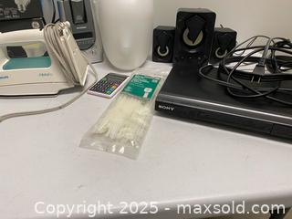 MaxSold Auction: Mixed Electronics and Household Lot – Philips Iron, Sony DVD Player, GE Smart Bulbs &#38; More - Vancouver (British Columbia, Canada) SELLER MANAGED Reseller Online Auction - East 7th Avenue (STORAGE)              