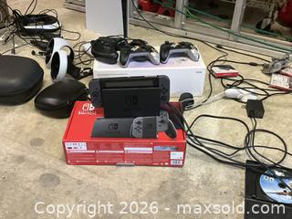 MaxSold Auction: Lot: Nintendo Switch OLED, PS VR2, AmScope Microscope & Controllers - Manassas (Virginia, USA) SELLER MANAGED Downsizing Online Auction - Spriggs Road