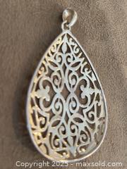 MaxSold Auction: Sterling Silver Pendant - London (Ontario, Canada) SELLER MANAGED Downsizing Online Auction - Doon Drive
