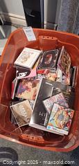 MaxSold Auction: Mixed media lot: CDs, DVDs, Video Games, Books in Orange Storage Tub B - Brampton (Ontario, Canada) Estate Sale Online Auction - Upper Highlands Drive