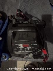 MaxSold Auction: Car creeper;Blue Steel Trolley Jack, Likely 2–3 Ton, Low-Profile; battery charger: oil - Halton Hills (Ontario, Canada) SELLER MANAGED Downsizing Online Auction - Barber Drive