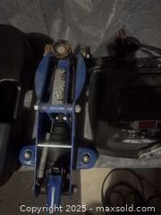 MaxSold Auction: Car creeper;Blue Steel Trolley Jack, Likely 2–3 Ton, Low-Profile; battery charger: oil - Halton Hills (Ontario, Canada) SELLER MANAGED Downsizing Online Auction - Barber Drive