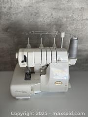 MaxSold Auction: RARE Baby Lock Evolution BLE8W-2 Serger ExtrordinAir Threading w/ Accessories - Menlo Park (California, USA) SELLER MANAGED Estate Sale Online Auction - Monte Rosa Drive