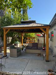 MaxSold Auction: 10 ft. x 10 ft. Wood Hardtop Gazebo with Galvanized Steel Double Roof - Los Angeles (California, USA) SELLER MANAGED Estate Sale Online Auction - Kittridge Street