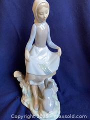 MaxSold Auction: 2 Figurines: Lladro Girl With a Rabbit #4826 and NAO by Lladro Peasant Girl With Rabbits - Oak Park (California, USA) PARTNER MANAGED Estate Sale Online Auction - Pesto Way