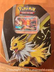 MaxSold Auction: Pokémon trading cards set with tin - Easton (Pennsylvania, USA) SELLER MANAGED Downsizing Online Auction - South 12th Street