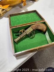 MaxSold Auction: Decorative 19th-Century Style Flintlock/Pepperbox Replica - Windsor (Ontario, Canada) PARTNER MANAGED Downsizing Online Auction - Ashland Drive