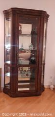 MaxSold Auction: Oak-Tone Wood Curio Cabinet with Glass Sides &#38; Mirrored Back - Windsor (Ontario, Canada) PARTNER MANAGED Downsizing Online Auction - Ashland Drive