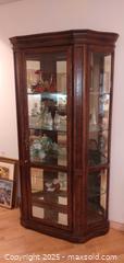 MaxSold Auction: Oak-Tone Wood Curio Cabinet with Glass Sides &#38; Mirrored Back - Windsor (Ontario, Canada) PARTNER MANAGED Downsizing Online Auction - Ashland Drive