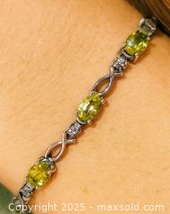 MaxSold Auction: 10K(4.01g) Peridot(2.7)Diamond(0.012ct) - Toronto (Ontario, Canada) PARTNER MANAGED Downsizing Online Auction - Queen Street East