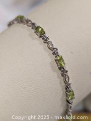 MaxSold Auction: 10K(4.01g) Peridot(2.7)Diamond(0.012ct) - Toronto (Ontario, Canada) PARTNER MANAGED Downsizing Online Auction - Queen Street East