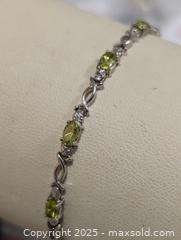 MaxSold Auction: 10K(4.01g) Peridot(2.7)Diamond(0.012ct) - Toronto (Ontario, Canada) PARTNER MANAGED Downsizing Online Auction - Queen Street East