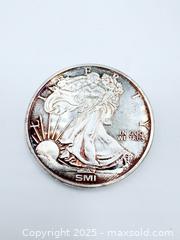 MaxSold Auction: Sunshine Minting (SMI) 1-Ounce 999 Silver Round - Esquimalt (British Columbia, Canada) PARTNER MANAGED Reseller Online Auction - Lampson Street