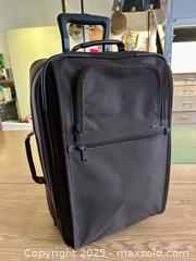 MaxSold Auction: TUMI 2 Wheeled Carry-on Suitcase - Toronto (Ontario, Canada) SELLER MANAGED Downsizing Online Auction - Nassau Street