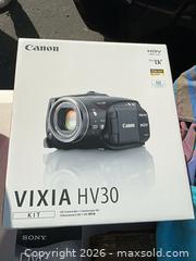 MaxSold Auction: Mixed Electronics & Collectibles Lot — Canon VIXIA HV30 Kit - Commerce (California, USA) PARTNER MANAGED Estate Sale Online Auction - Randolph Street (STORAGE)